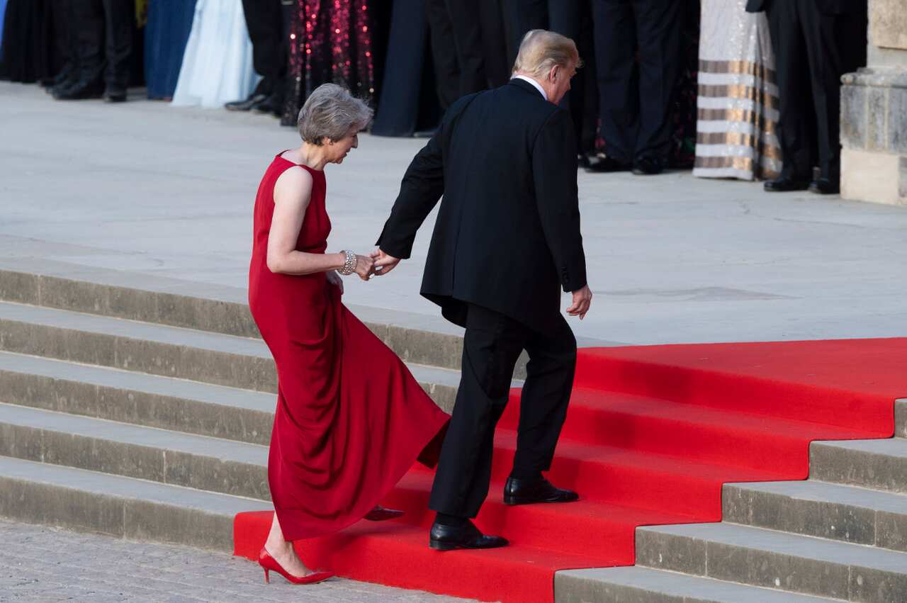 US President Donald Trump and Prime Minister Theresa May arrive at Blenheim Palace ahead of a black-tie dinner. 