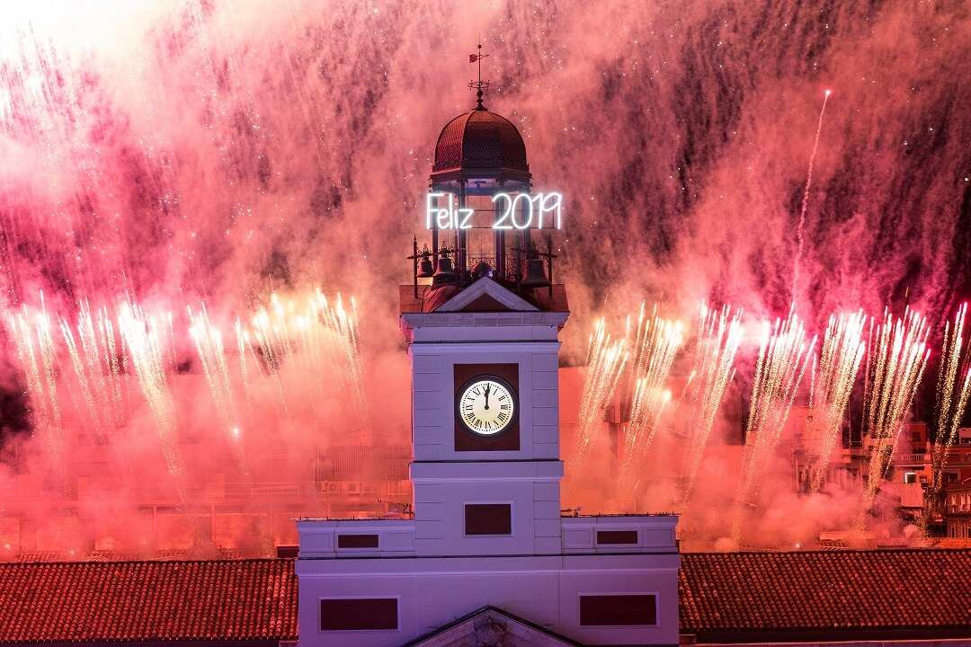 The clock at Spain's Puerta del Sol rings at midnight.