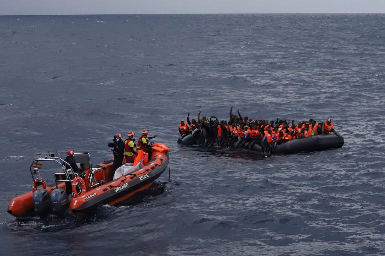 Refugees and migrants wait to be rescued by members of the Spanish NGO Proactiva Open Arms, after leaving Libya trying to reach Europe.