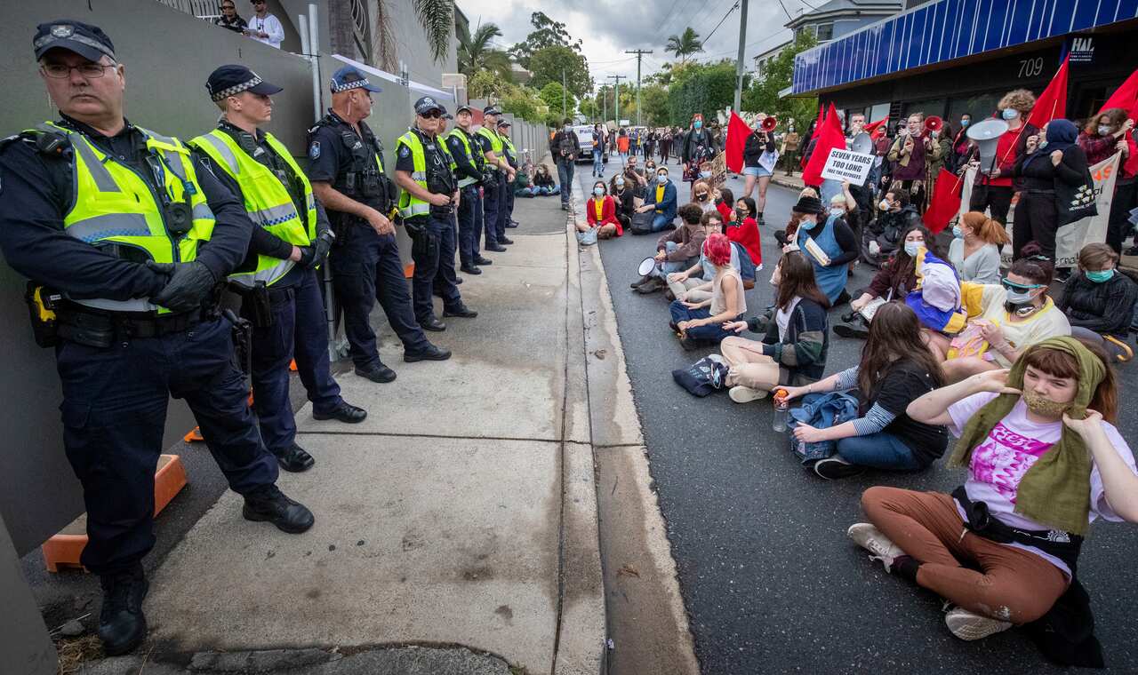 Protesters gather to support asylum seekers detained at the Kangaroo Point Central Hotel in Brisbane, Sunday, 28 June, 2020. 