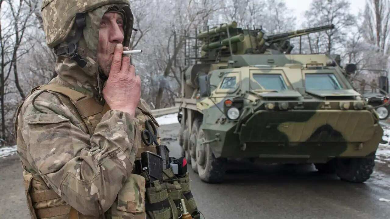 A Ukrainian soldier smokes a cigarette on his position at an armored vehicle outside Kharkiv, Ukraine. President Volodymyr Zelenskyy claimed Saturday that Ukraine's forces had repulsed the assault and vowed to keep fighting.