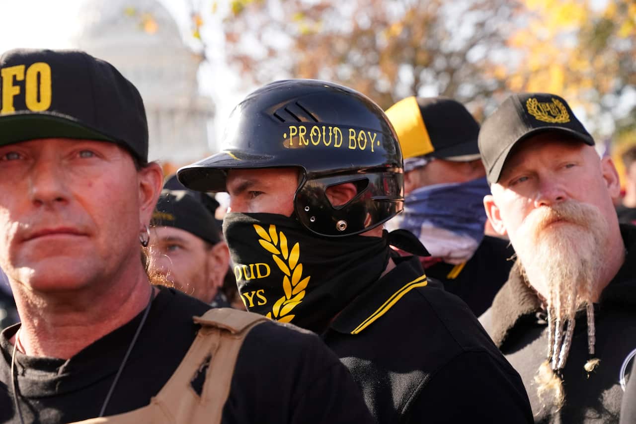 A person wearing attire with the words Proud Boys on it joins supporters of President Donald Trump in a march Saturday Nov. 14, 2020, in Washington. (AP Photo/Jacquelyn Martin)