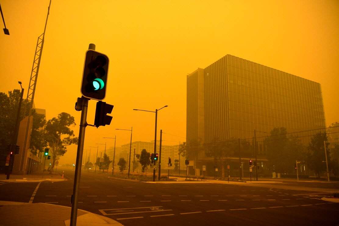 Empty streets are seen as smoke haze impacts the city centre early morning in Canberra, Sunday, 5 January, 2020.