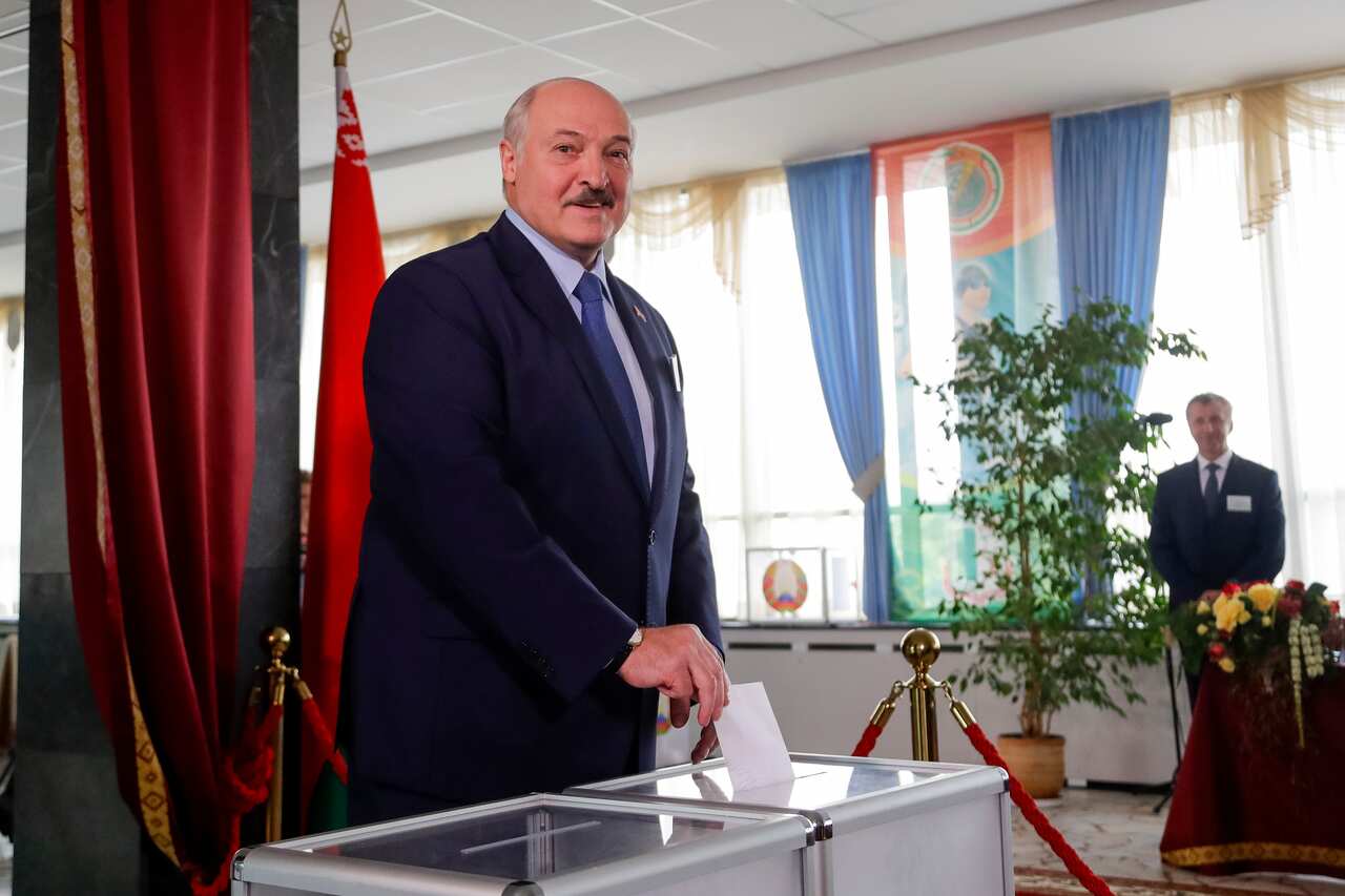 Belarusian President Alexander Lukashenko casts his ballot at a polling station during the presidential election in Minsk, Belarus, Sunday.