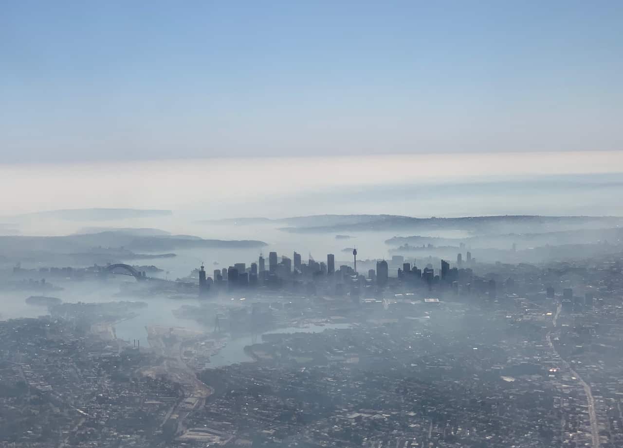 In an image taken on a smart phone from a plane window, shows smoke haze blanketing Sydney.