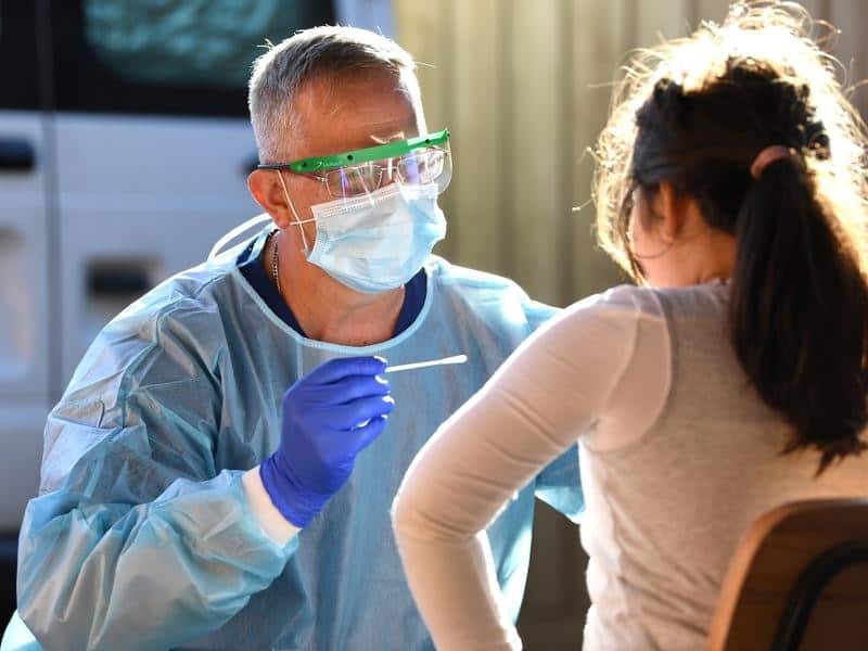 A nurse conducts a coronavirus test in Melbourne.