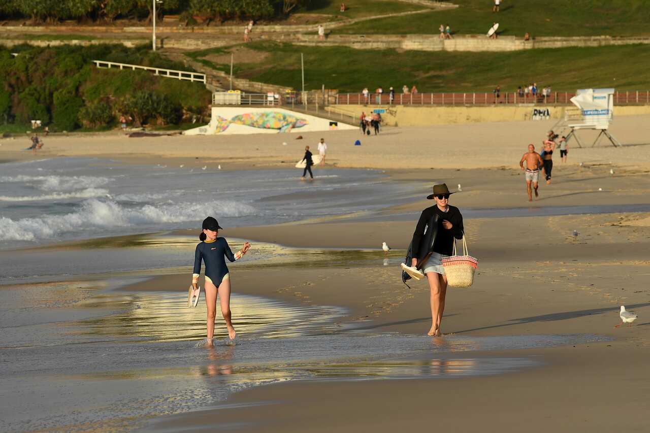 Beachgoers at sunrise at Bondi Beach in Sydney on Sunday morning. 