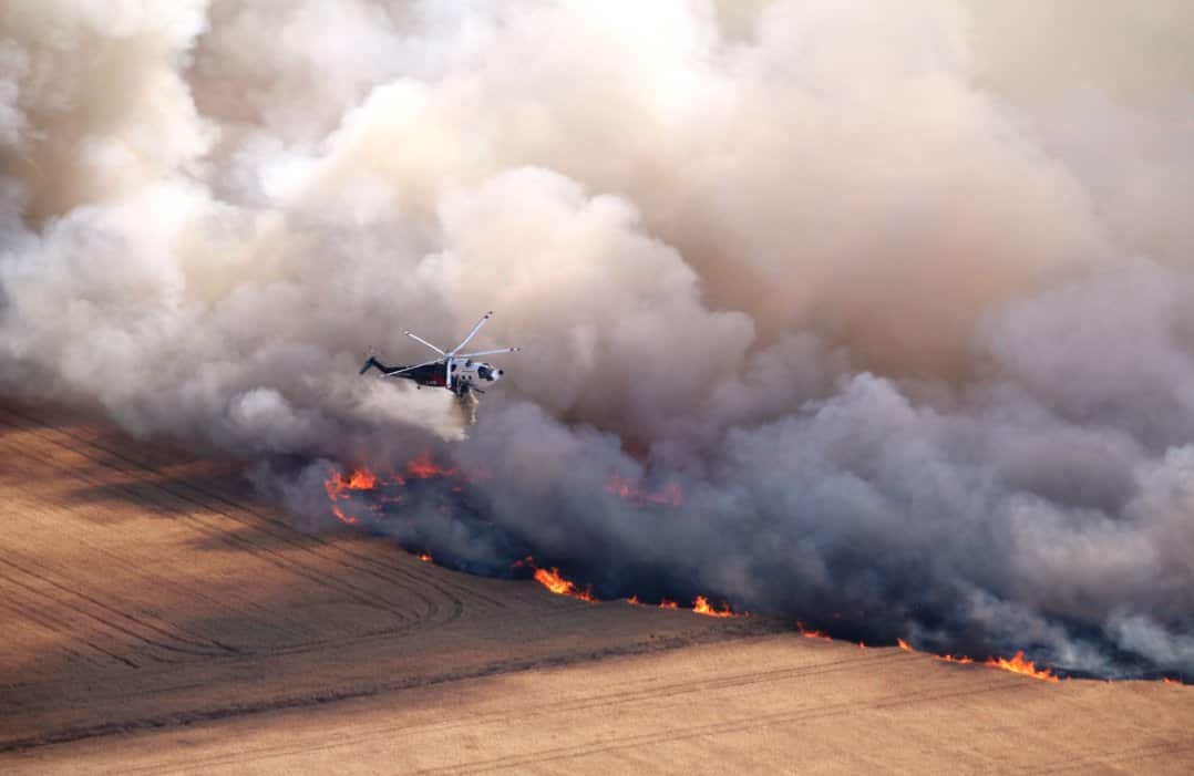 Fire crews attack flames from a fire burning at Mount Mercer.