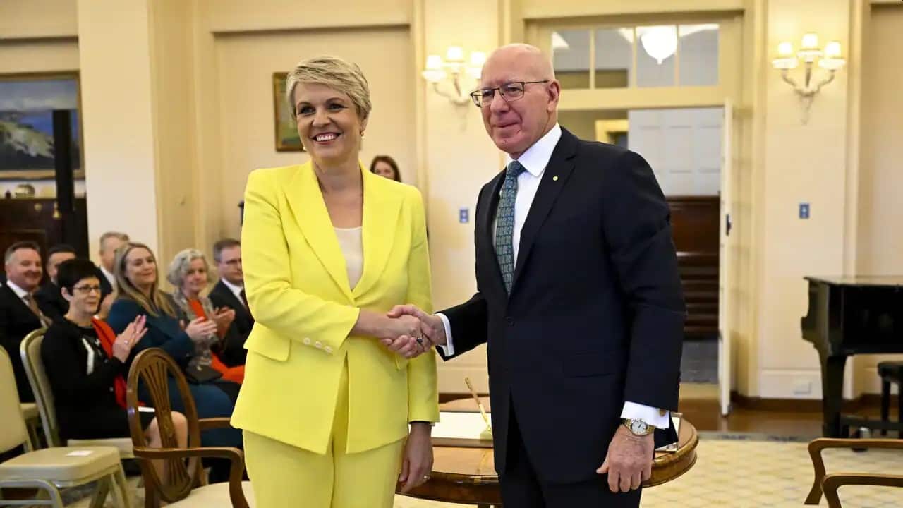 Australian Environment Minister Tanya Plibersek shakes hands with Australian Governor-General David Hurley during a swearing-in ceremony.
