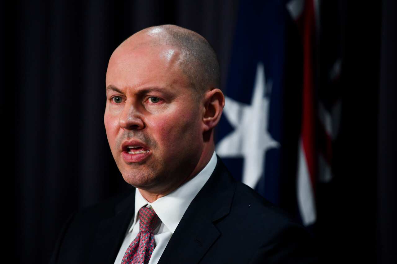 Australian Treasurer Josh Frydenberg speaks to the media during a press conference at Parliament House.