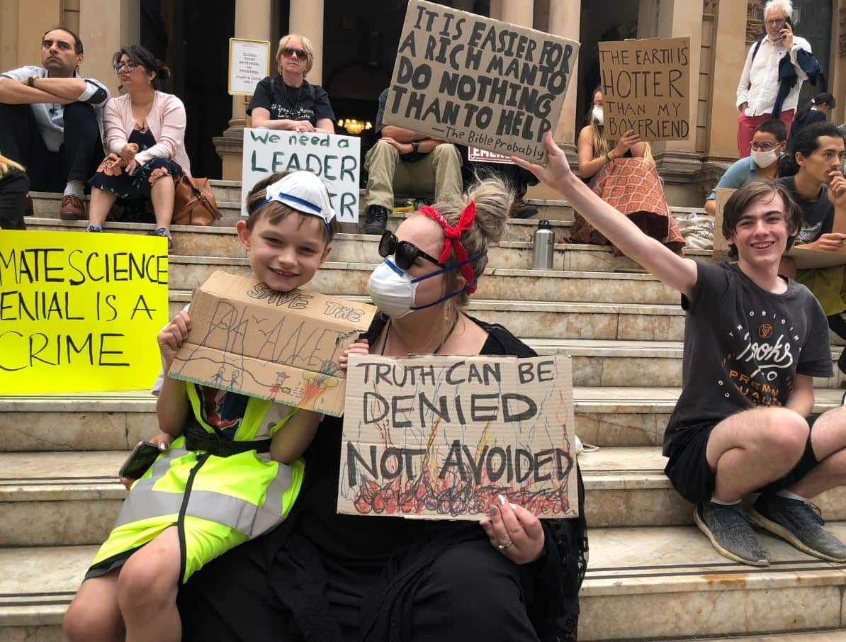 Protesters gather at Sydney Town Hall, demanding the government do more to combat climate change. 