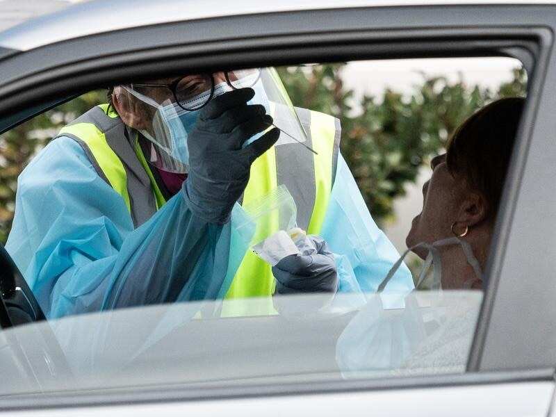 NSW health worker tests motorist for coronavirus.