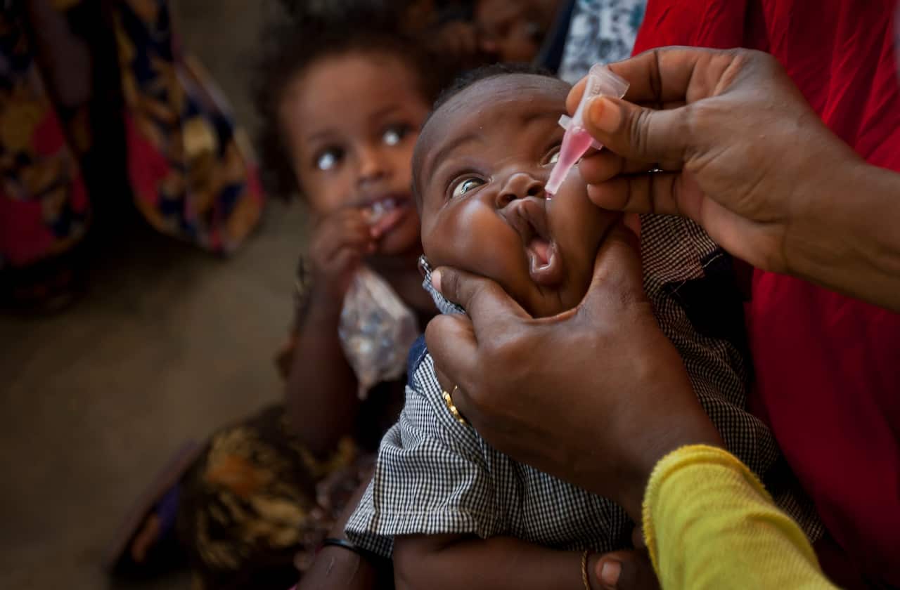 A Somali baby receives a polio vaccine at the Medina Maternal Child Health center in Mogadishu, Somalia in 2013.
