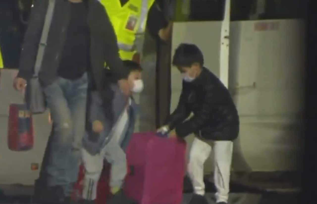 Children evacuated from Wuhan seen arriving at Christmas Island on Tuesday.