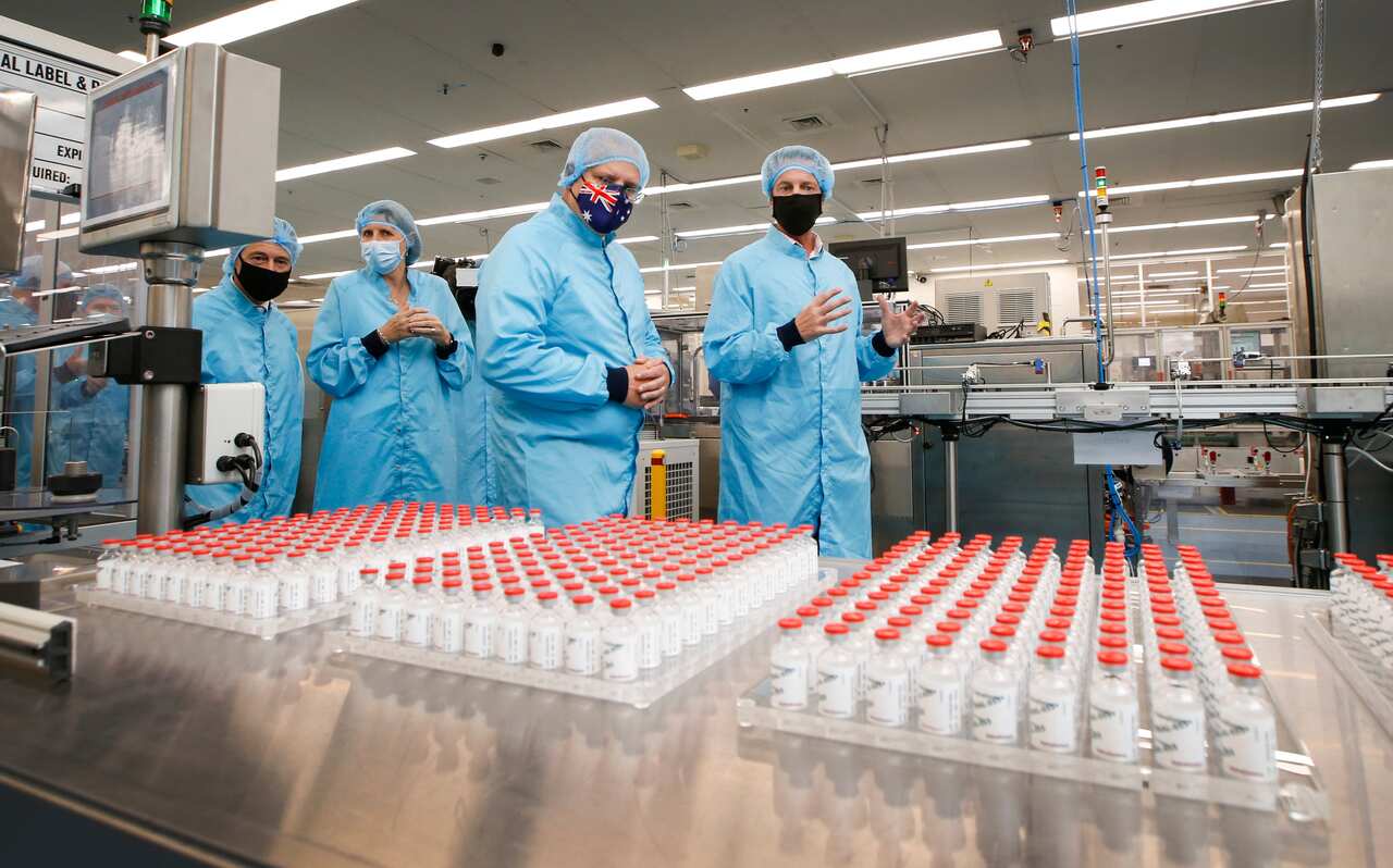 Prime Minister Scott Morrison walks past vials of the AstraZeneca vaccine as he visits the CSL serum lab  in Melbourne in February.