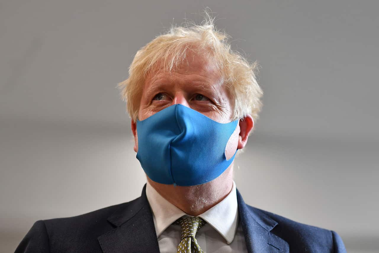 Britain's Prime Minister Boris Johnson now wears a face mask in public