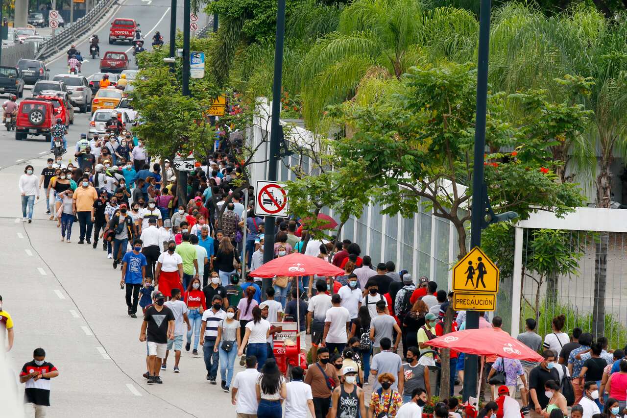 Voters line up during polls in a first round presidential and legislative election. (AP Photo/Angel Dejesus).