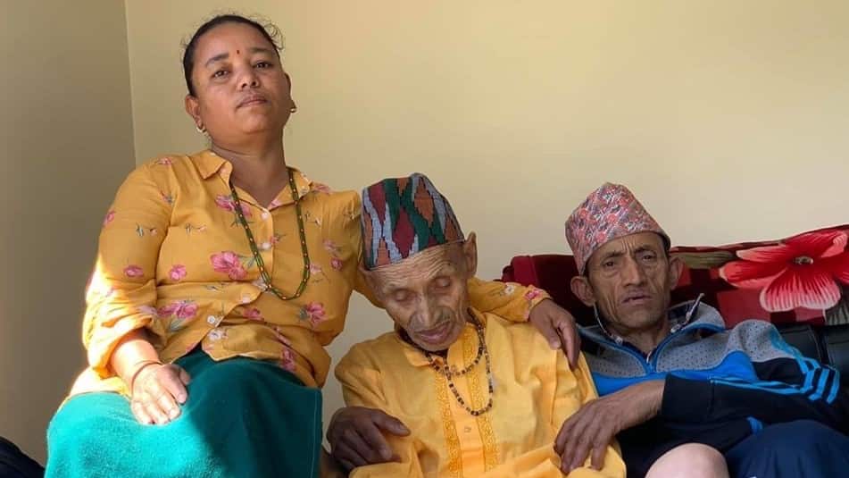 Ashna's grandfather Chandra Bir Thapa (centre) was diagnosed with cancer in 2019. Captured with his son and daughter-in-law.