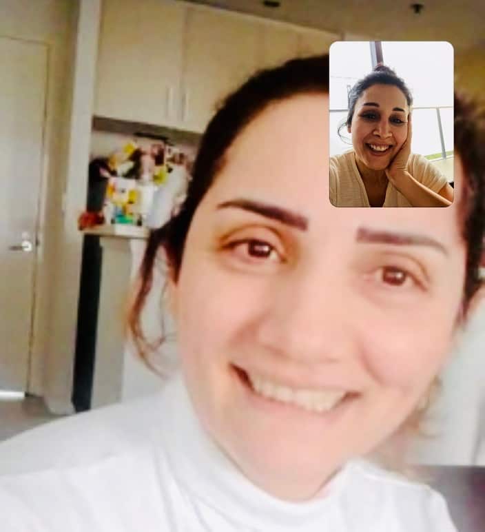 Shazia (inset) talking to new settler Bahja from Syria via video chat.