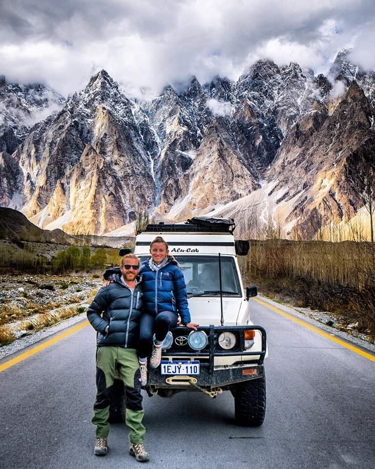 The nomadic couple stop for a photo on the Karakoram Highway.