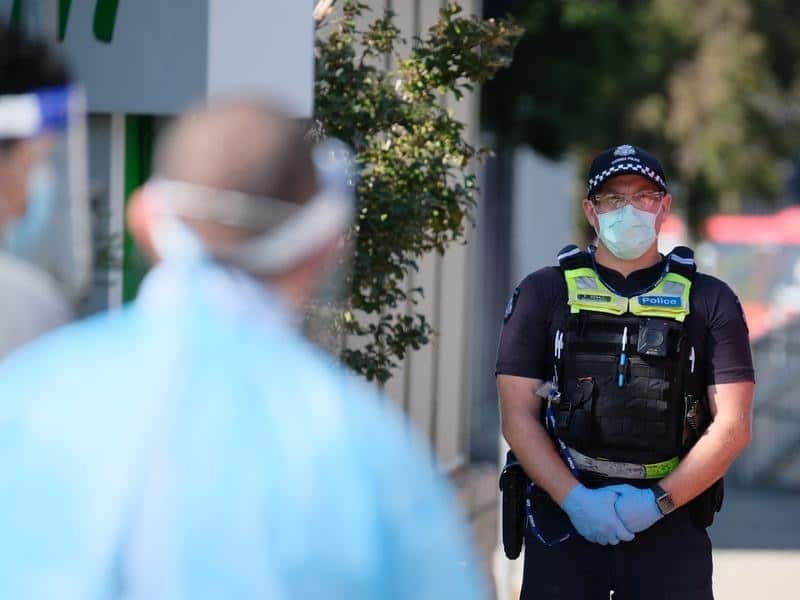 A policeman stands outside the Holiday Inn.