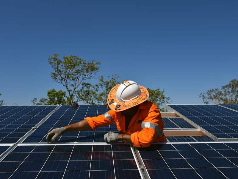 Northern Territory workers install solar panels
