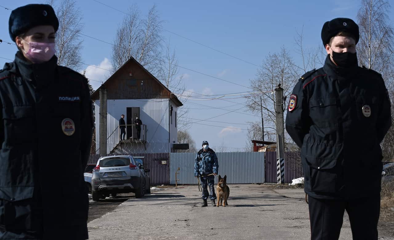 Police officers guard the entrance to the penal colony N2, where Alexei Navalny is serving a two-and-a-half year prison term, in the town of Pokrov on 6 April.