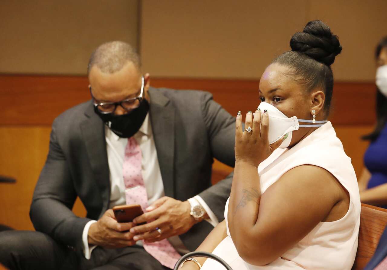 Rayshard Brooks' widow Tomika Miller (R) in court awaiting the announcement of charges 