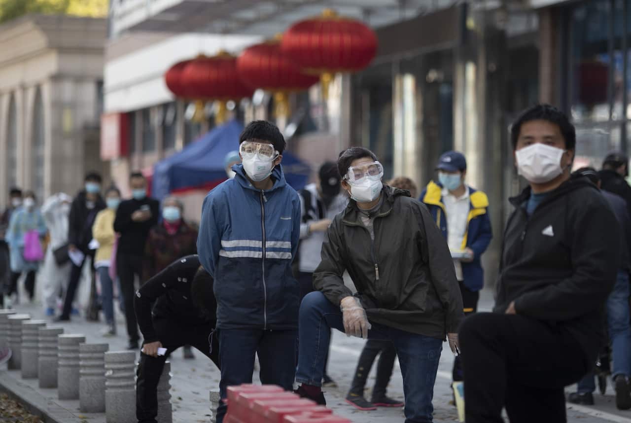 Patients wait in line outside the fever clinic of Wuhan Union Medical College Hospital for nucleic acid detection, Wuhan, Hubei Province, China.