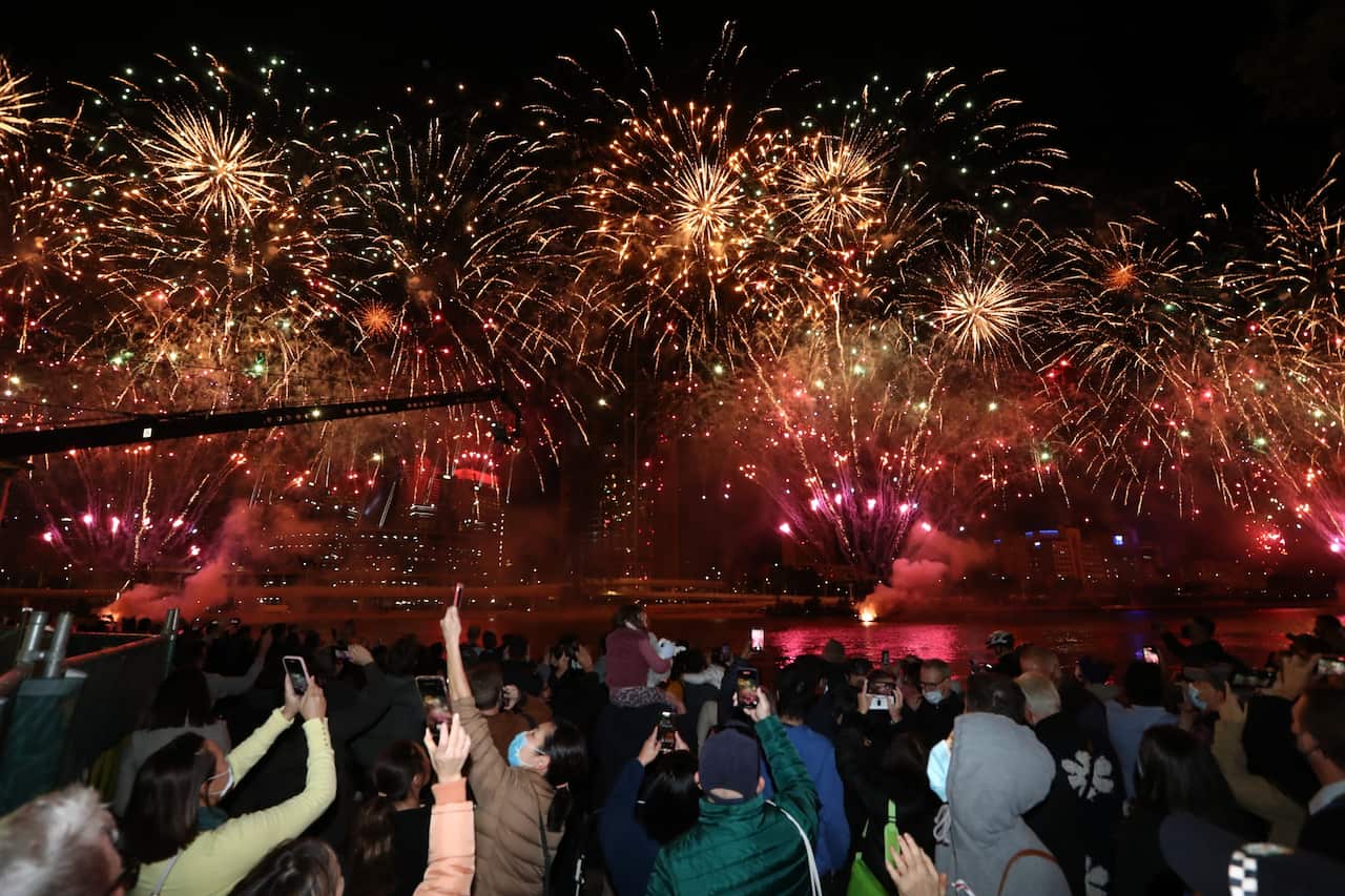 People celebrate in Brisbane after the International Olympic Committee voted to confirm the city will host the 2032 Summer Olympics, on 21 July, 2021.