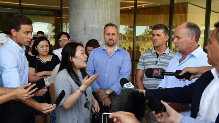 A frustrated resident asks questions of Icon Managing Director Julian Doyle