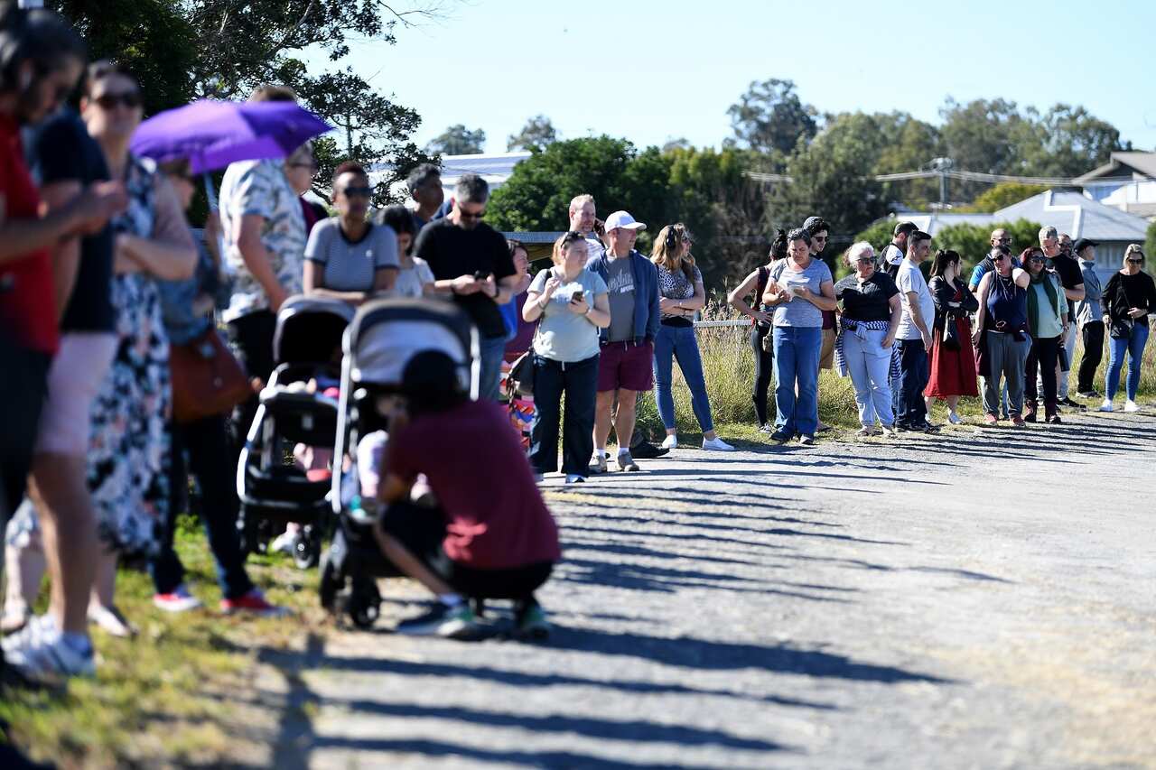 People line up to receive a coronavirus vaccination at the Rocklea Showgrounds in Brisbane on 5 June 2021. 