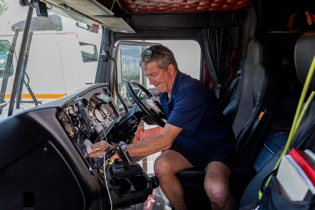 An Australian truckie cleaning out the cabin of his semi trailer.