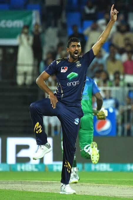 Mohammad Irfan Jr celebrating after taking a wicket in Pakistan Super League cricket tournament.