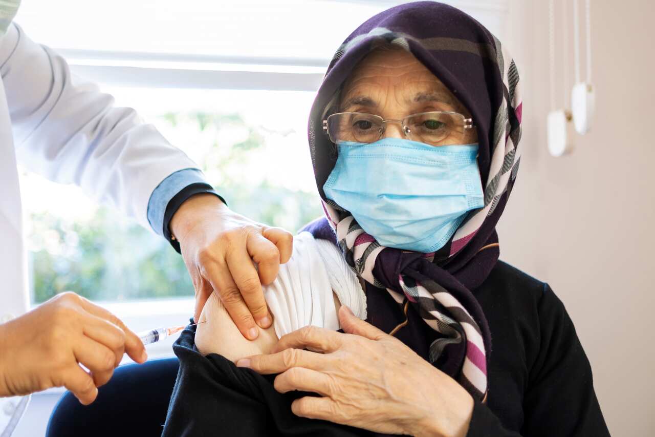 Senior woman getting a COVID-19 vaccine