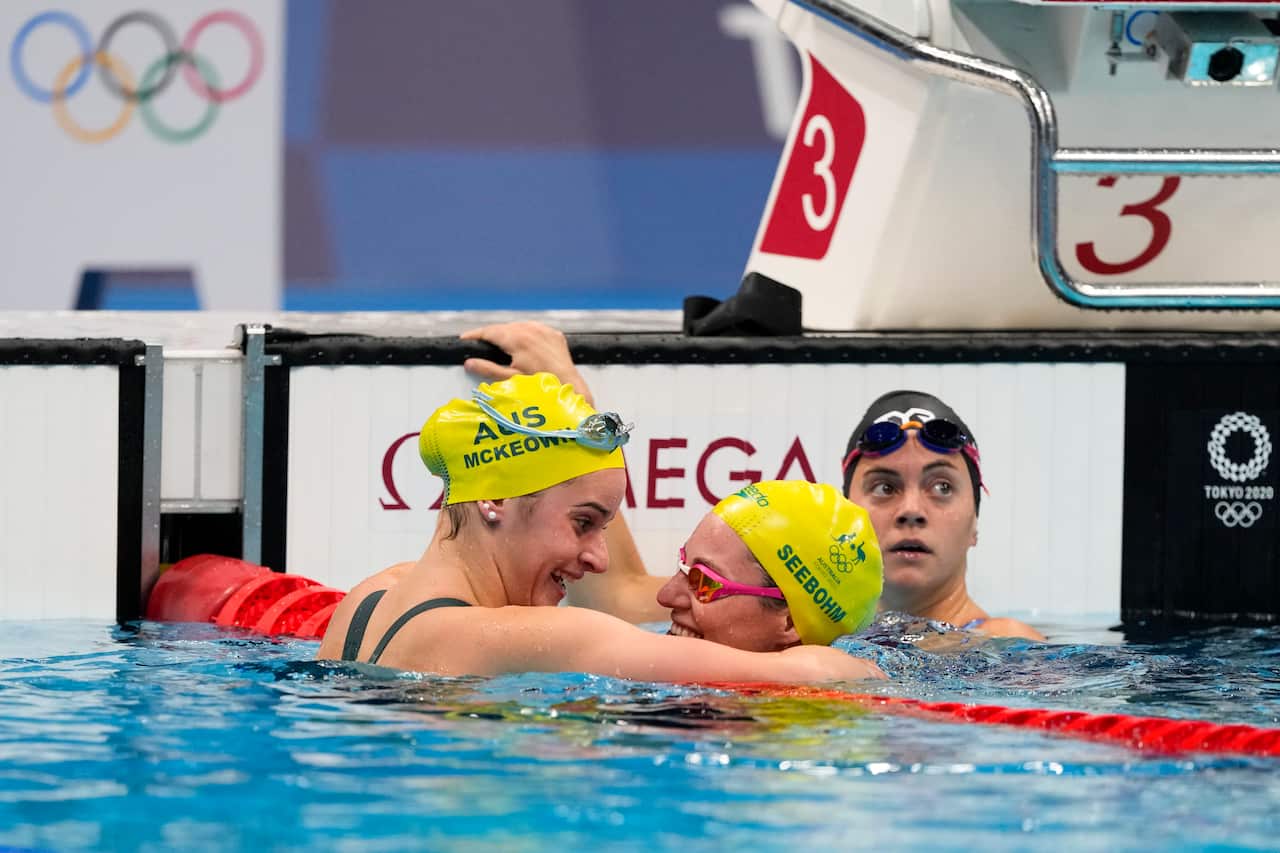 Australia's Kaylee McKeown, left, celebrates her gold medal with Emily Seebohm after the women's 200-meter backstroke final