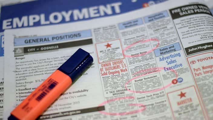 Job adverts are seen in a weekend newpaper in Canberra, Wednesday, Nov. 11, 2015.   (AAP Image/Lukas Coch) NO ARCHIVING