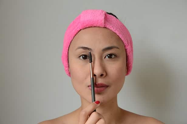 put the brush along the side of your nose