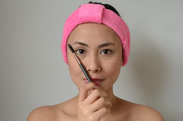 Angle the brush from the outside of your nose