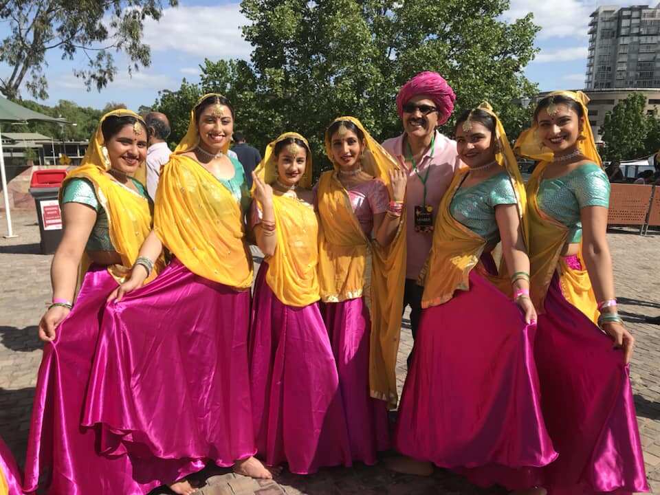Indian people dressed in traditional attire perform the traditional dance during a Diwali celebration at Federation Square in Melbourne.