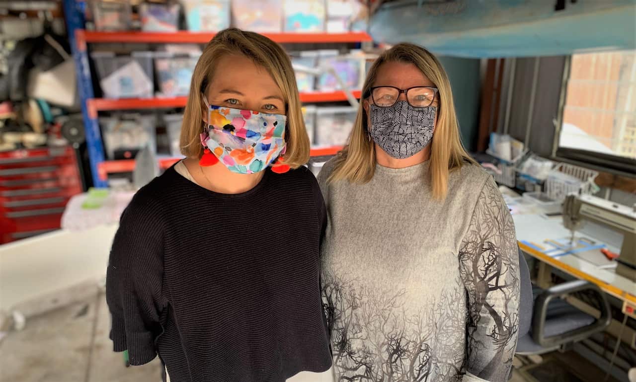 Amy and Marianne Buckley, wearing their home made masks.