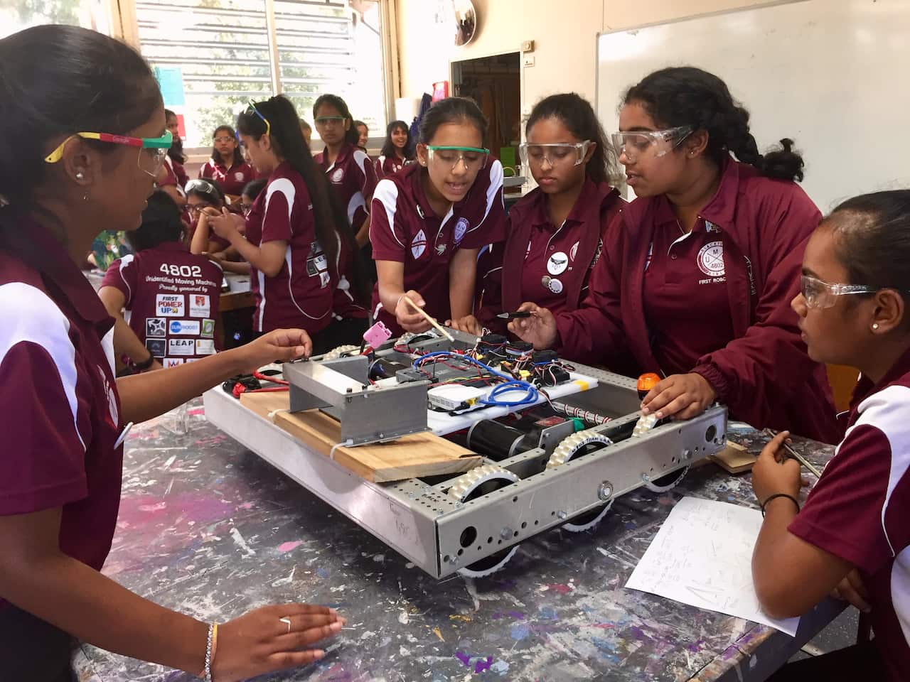 Blacktown Girls High School students prepare their robot for competition in the US.