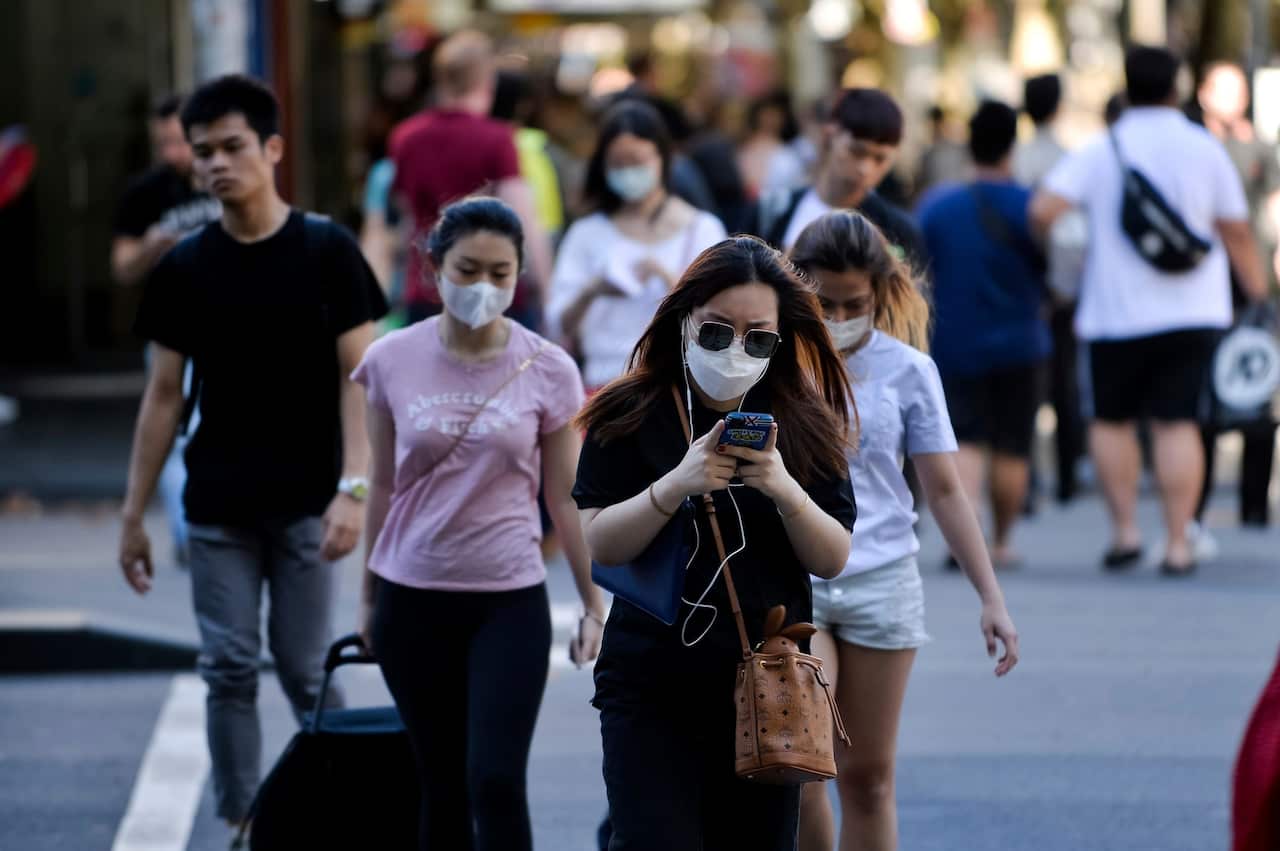 People wearing masks in Melbourne on 17 March 2020.