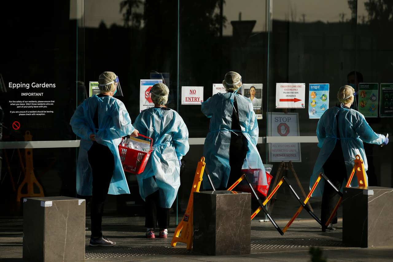 Cleaners are seen at Epping Gardens aged care facility in Epping, Melbourne, Thursday, July 30, 2020. (AAP Image/Daniel Pockett) NO ARCHIVING