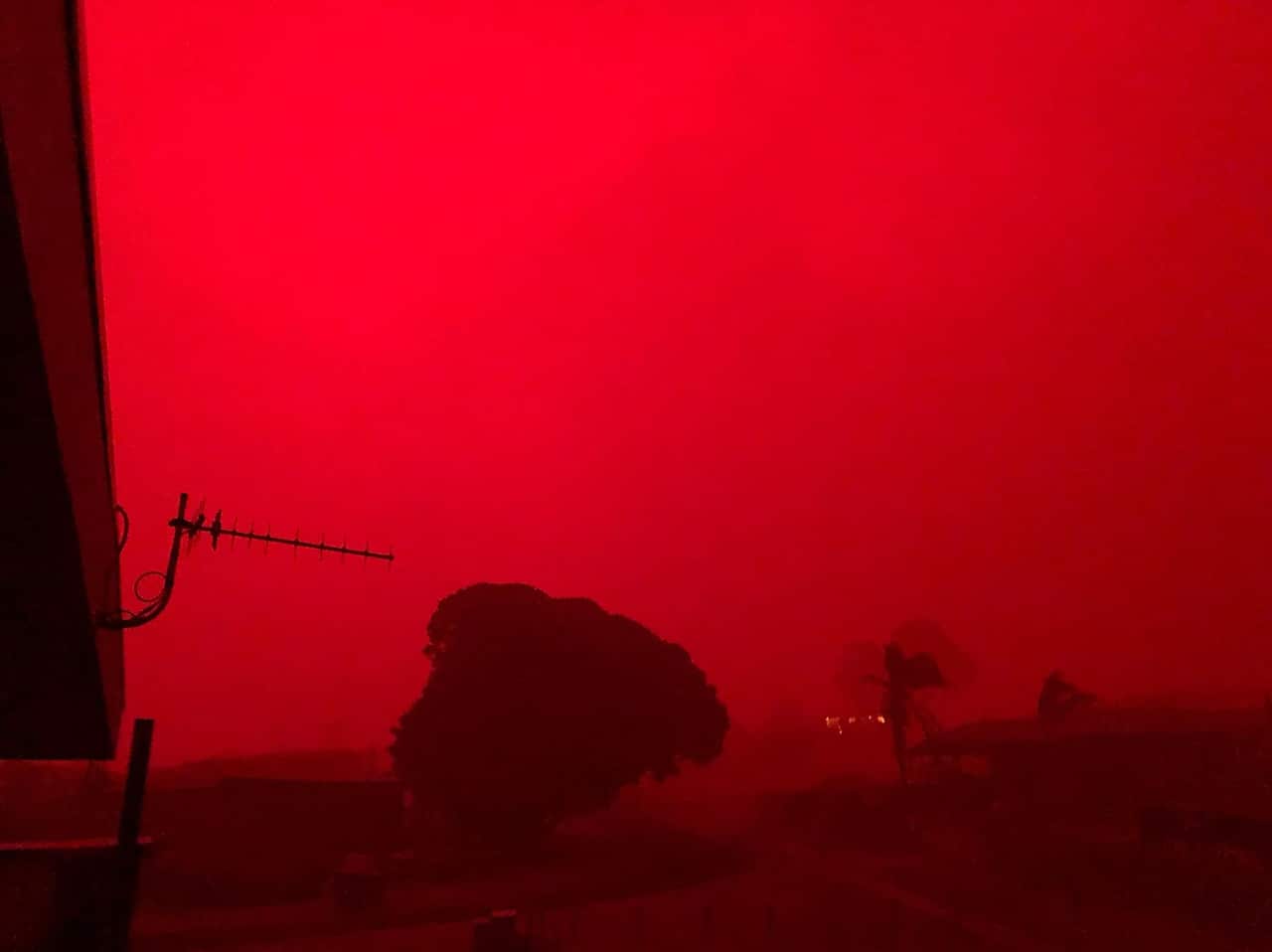A red sky is seen as bushfires approach Mallacoota, Tuesday, December 31, 2019. 
