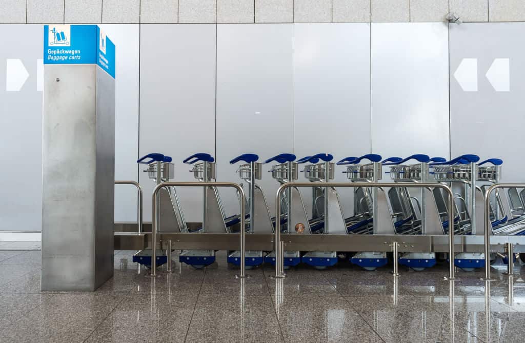 Baggage carts are standing up in Terminal 2 of Frankfurt Airport. 