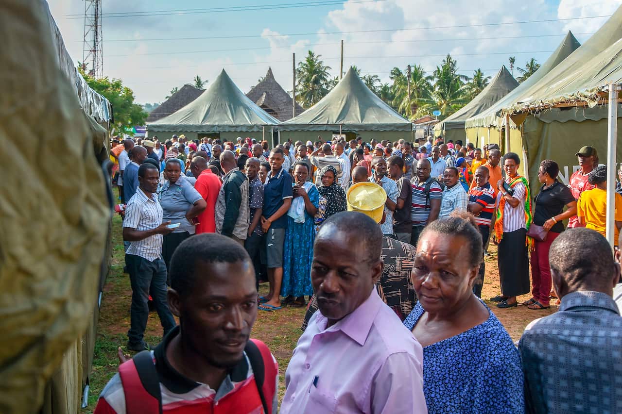 Voters form parallel queues as they wait for the voting to open at Wazo Hill polling station in Dar es Salaam, Tanzania, on October 28, 2020. 