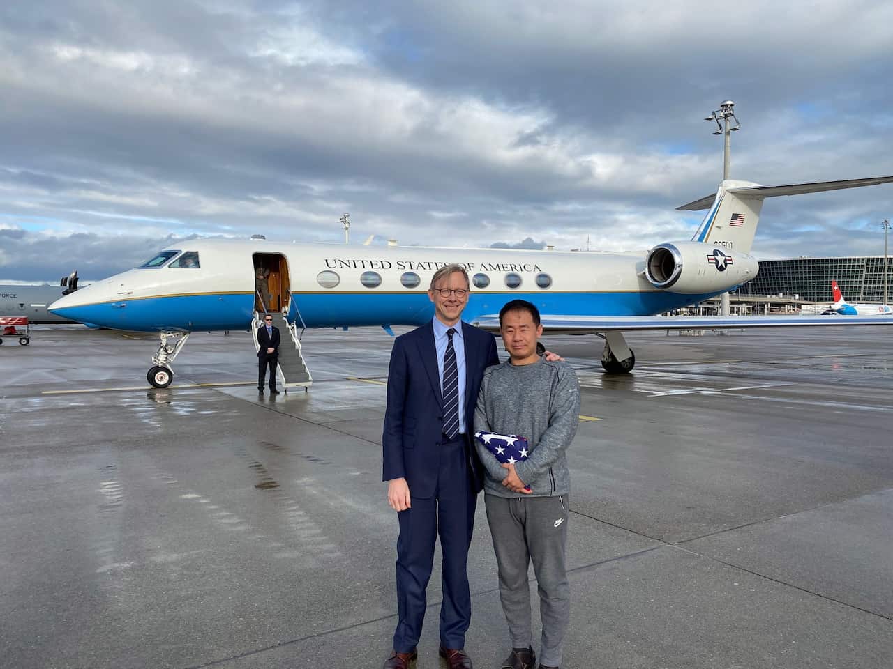 Freed US prisoner Xiyue Wang (R) and US State Department's Special Representative for Iran Brian Hook in Zurich, Switzerland.
