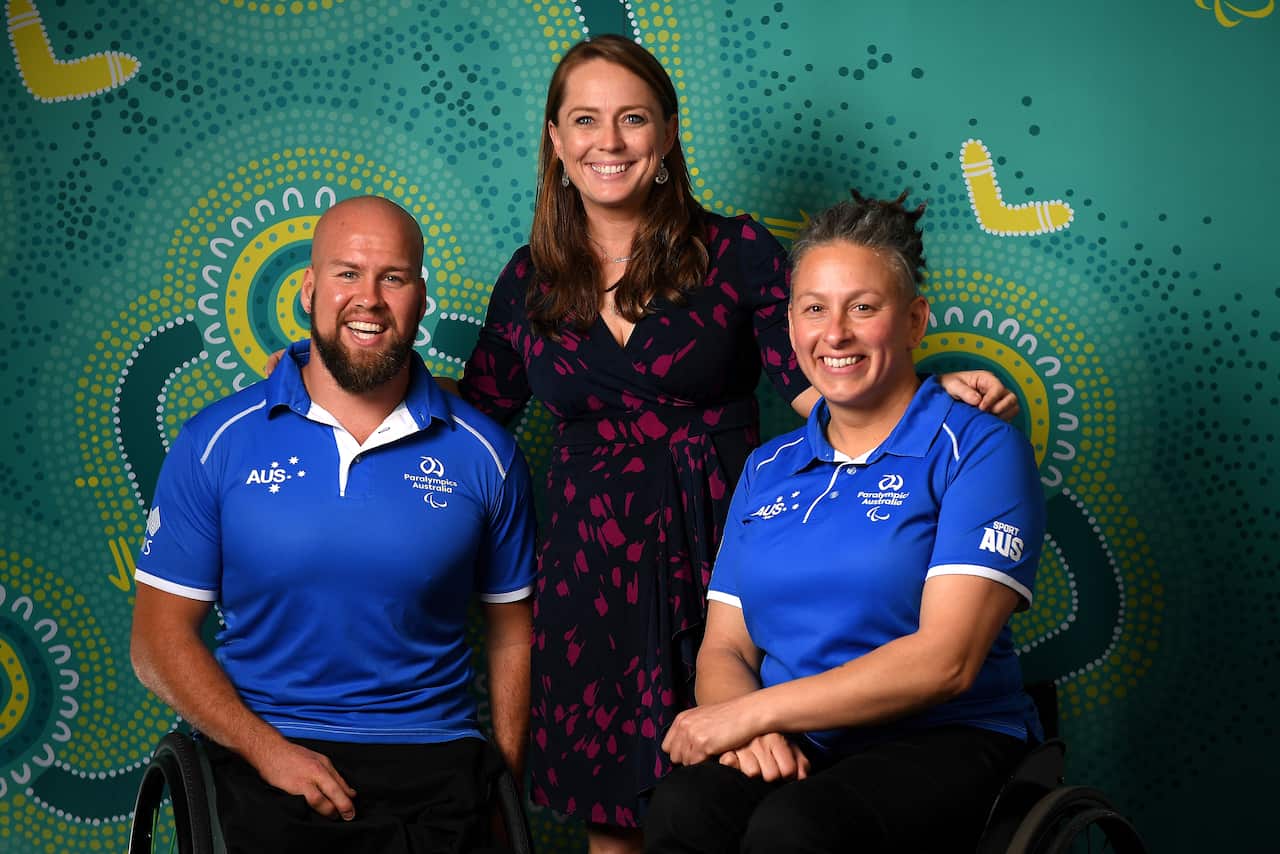 Australian Paralympic athletes Ryley Batt and Danni Di Toro pose for a photograph with Chef de Mission Kate Mcloughlin.