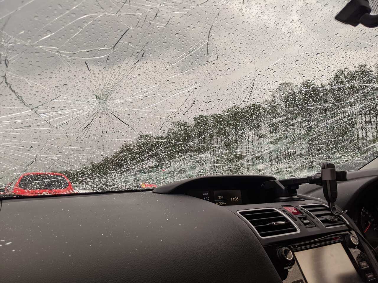 A car windshield with damaged sustained from hail stones in south-east Queensland
